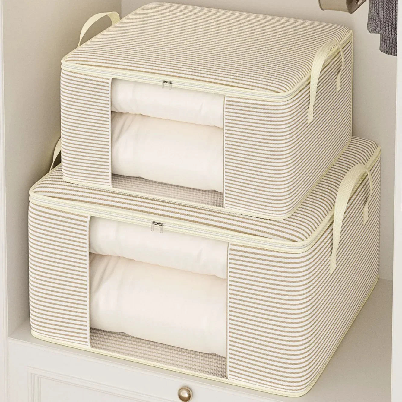 Two beige storage baskets with lids stacked on a white surface.