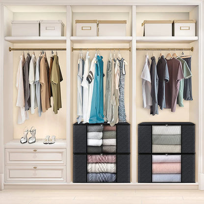Organized closet with clothes hanging and folded in black cube organizers.