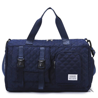 Blue duffel bag with multiple straps and zippers on a white background