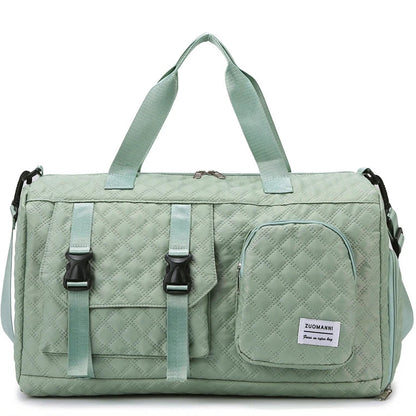 Green quilted duffel bag with straps on a white background