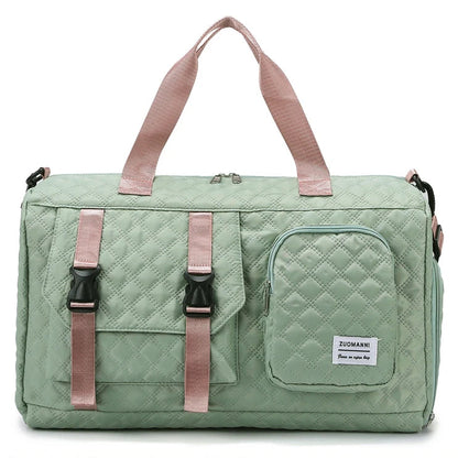 Green quilted duffel bag with pink straps on a white background