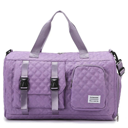 Purple quilted duffel bag with straps on a white background