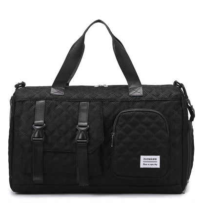 Black duffel bag with quilted pattern on a white background