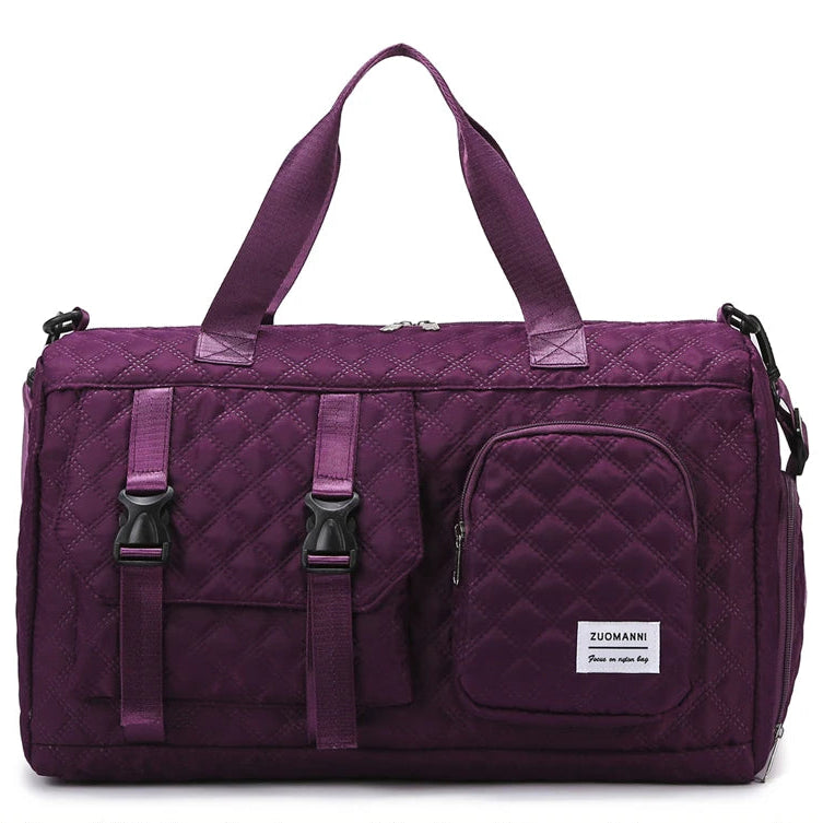 Purple quilted duffel bag with straps on a white background