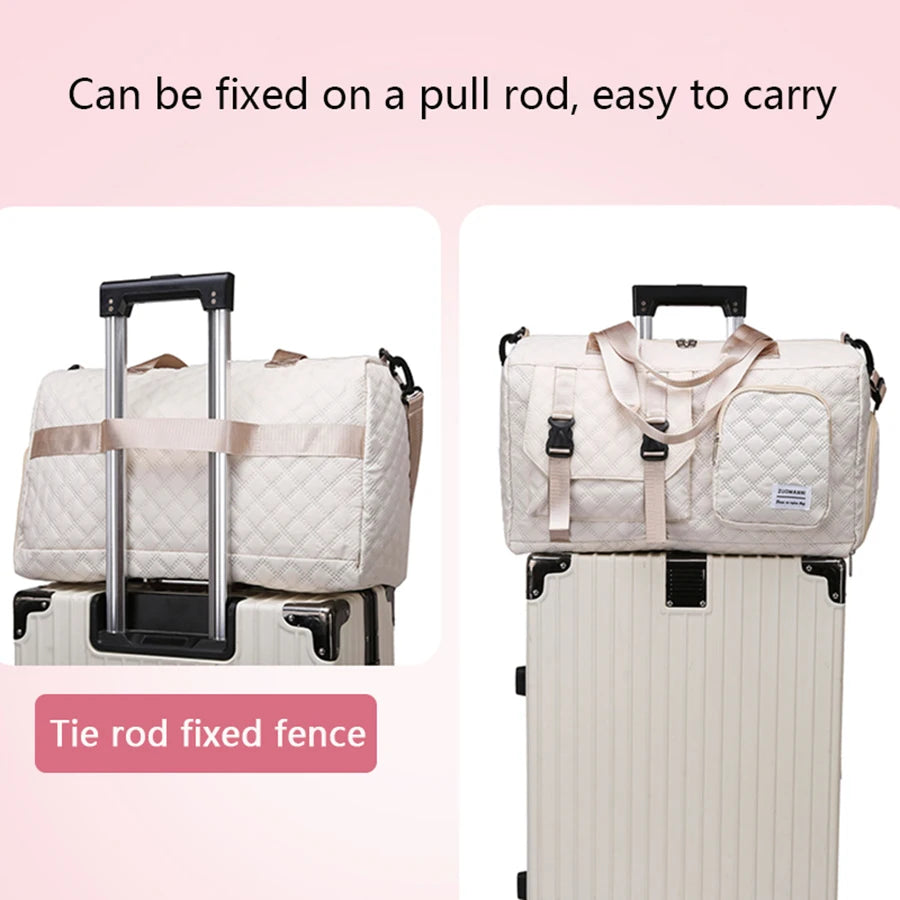 White quilted duffel bag with wheels attached to a suitcase on a pink background