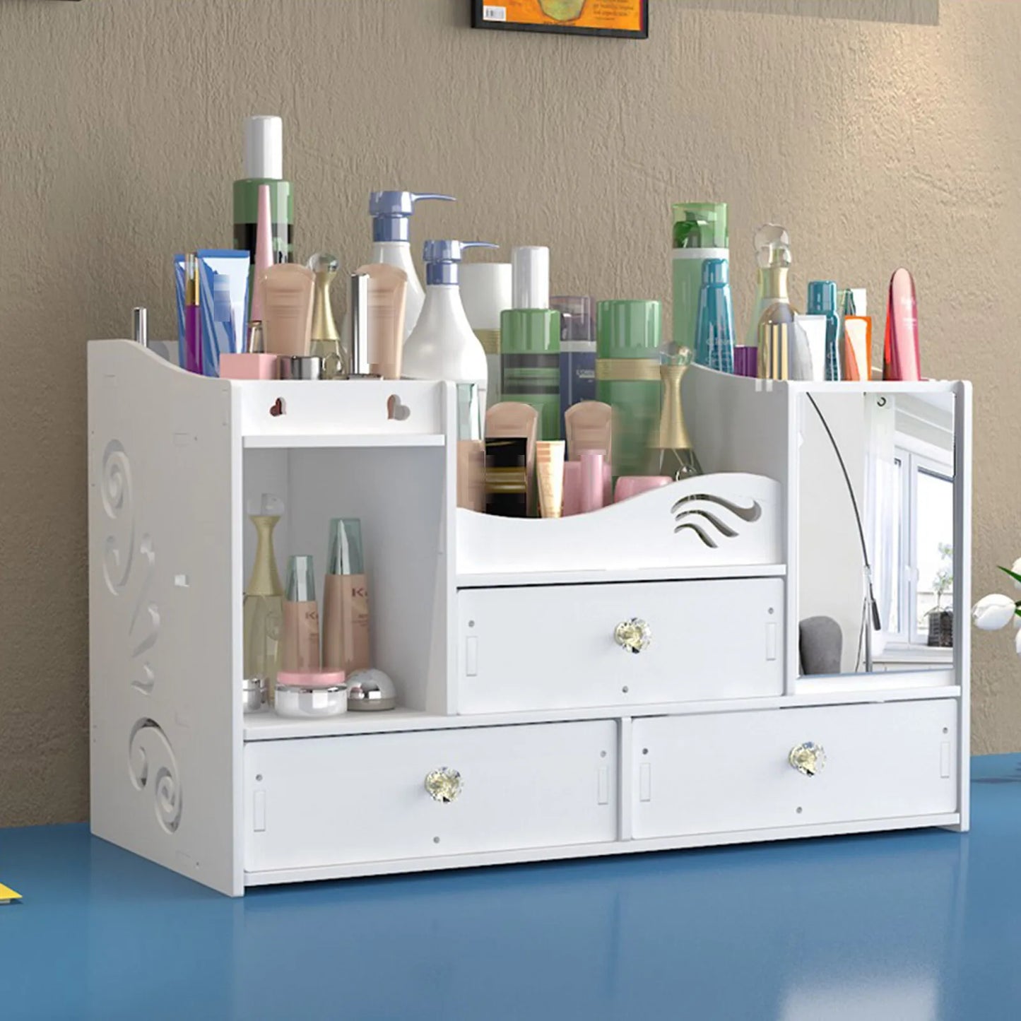 White cosmetic organizer with various items on a blue surface