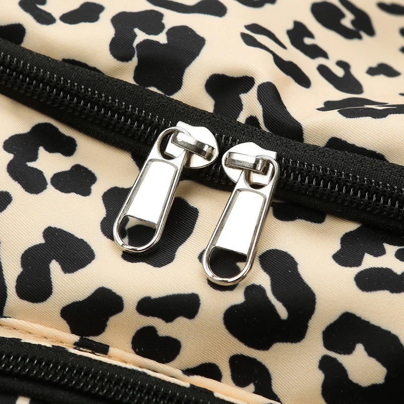 Leopard print fabric with a zipper and metal pull