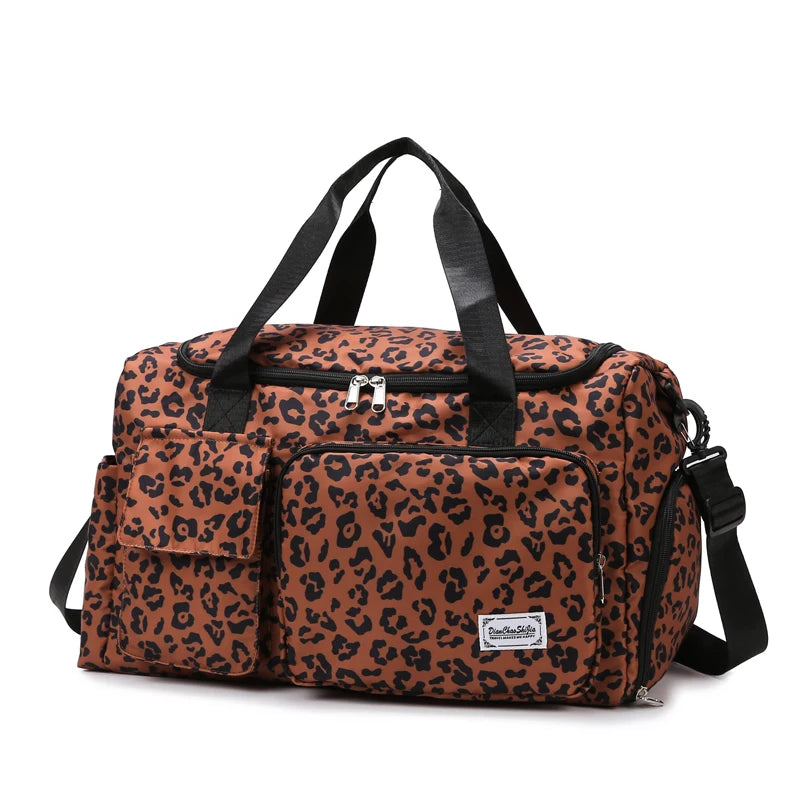 Leopard print duffel bag with black straps on a white background
