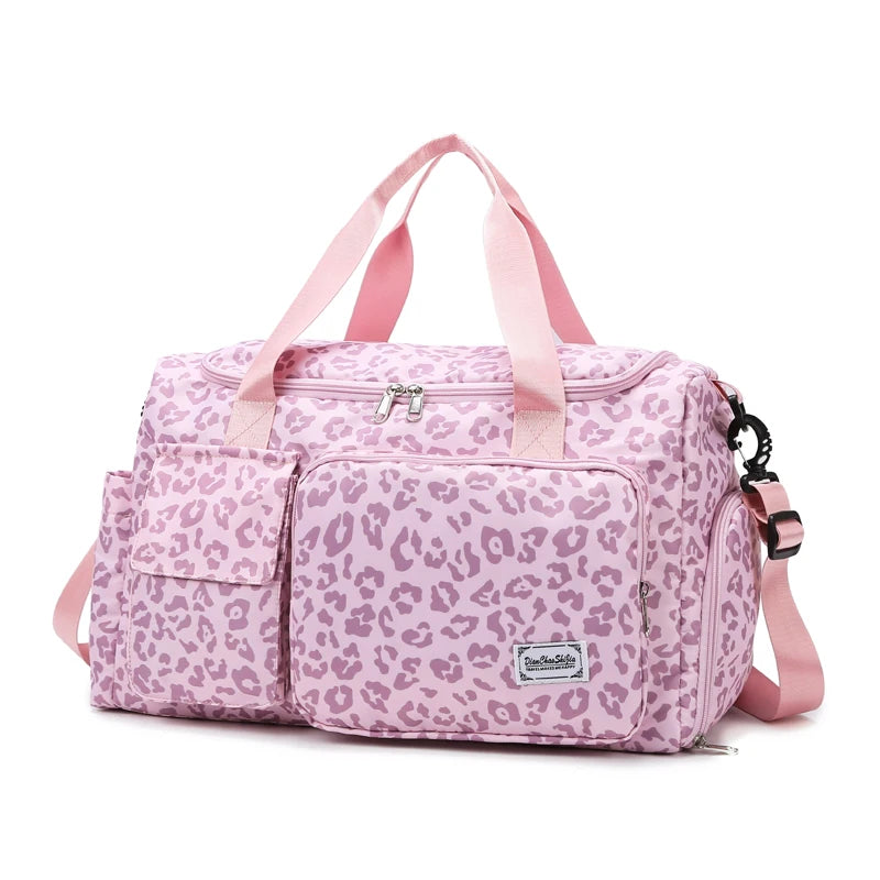 Pink leopard print duffel bag with pink straps on a white background