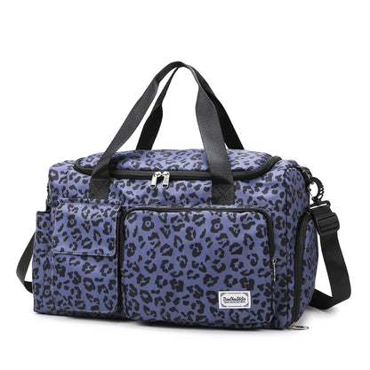 Blue leopard print bag with black straps on a white background