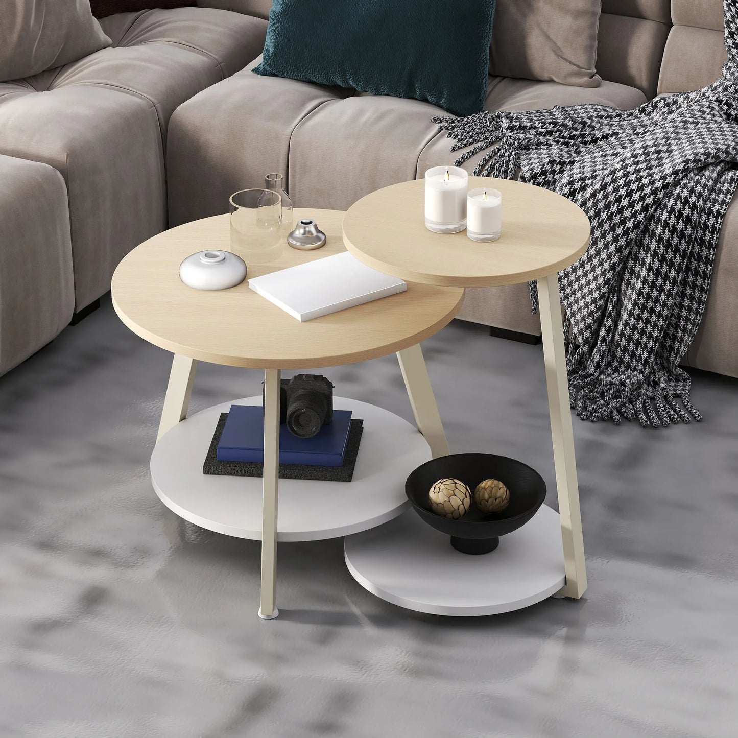 Round wooden coffee table with decorative items in a living room setting