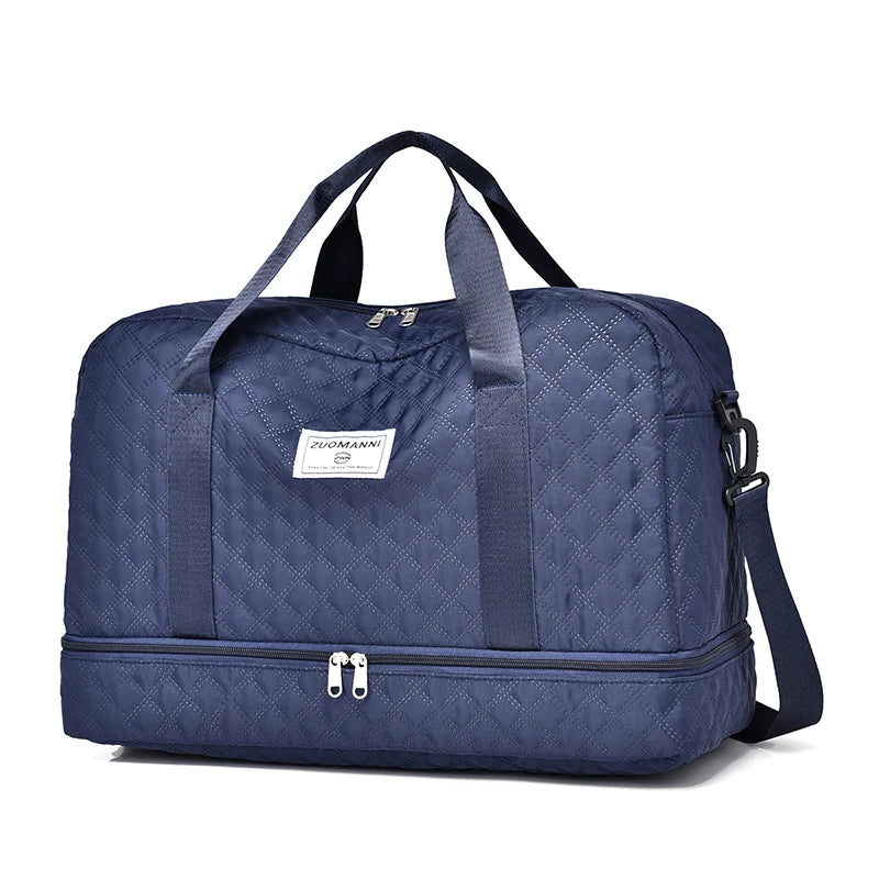 Blue quilted duffel bag with a visible brand label on a white background