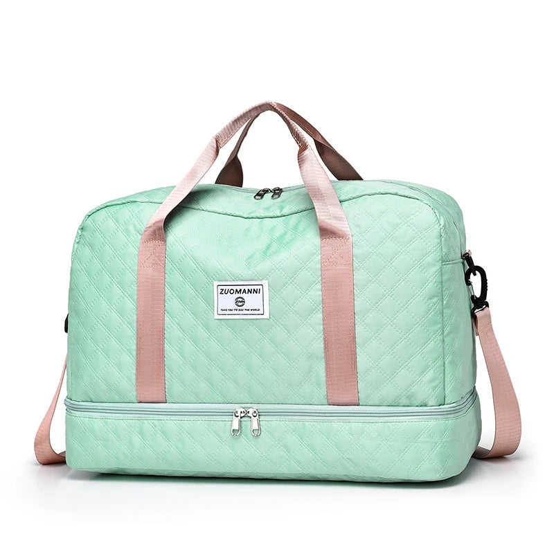 Mint green travel bag with pink straps on a white background