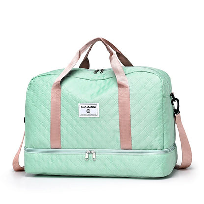 Mint green travel bag with pink straps on a white background