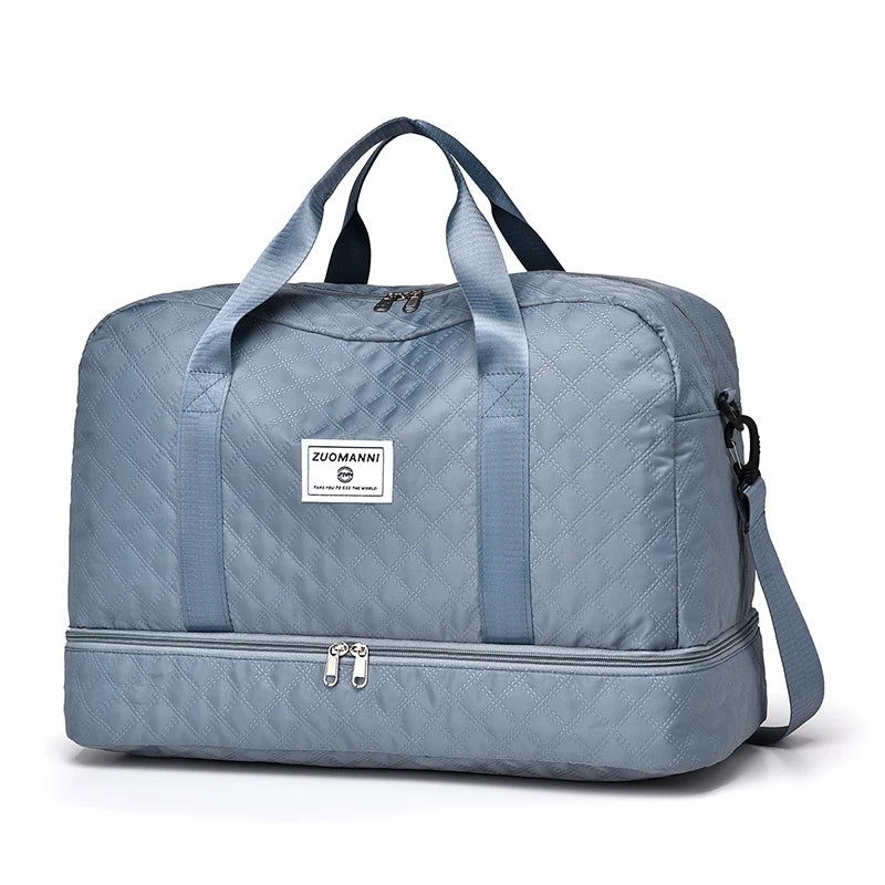 Blue duffel bag with a visible brand label on a white background