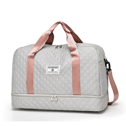 Gray duffel bag with pink straps on a white background
