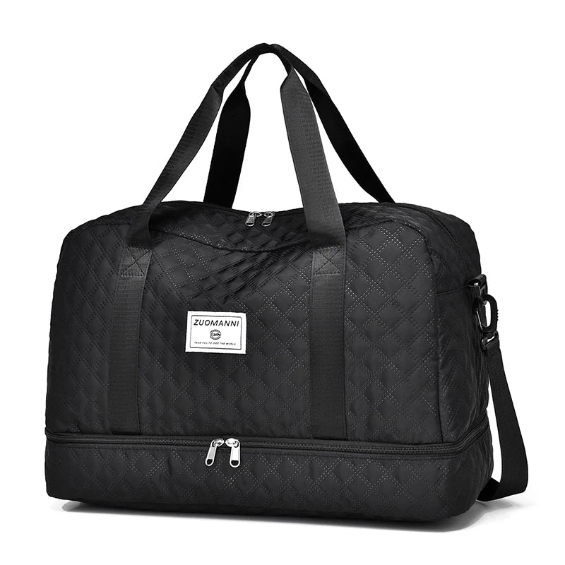 Black quilted duffel bag with a visible brand logo on a white background