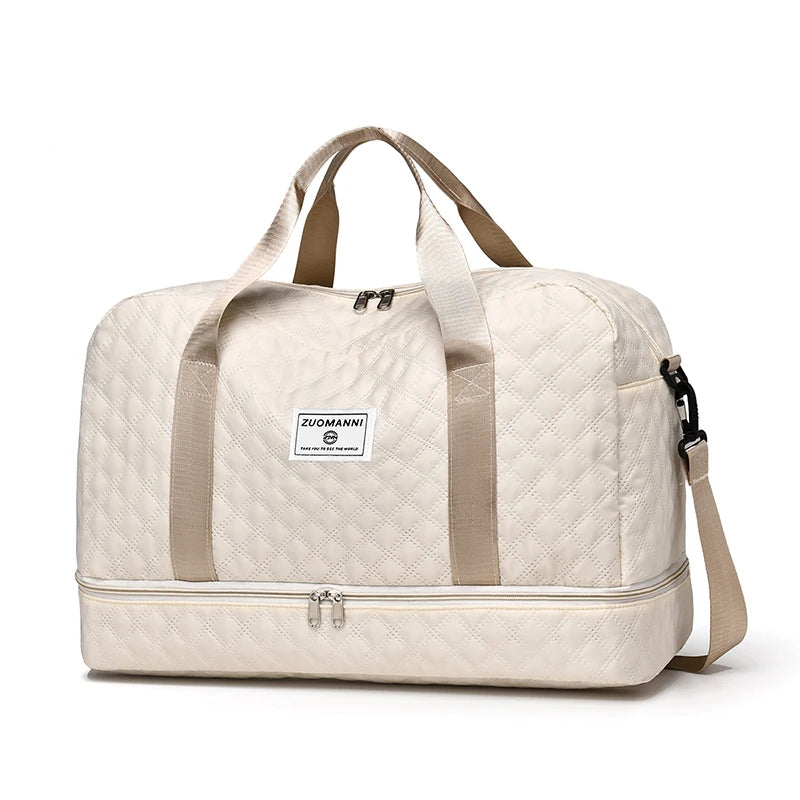Beige quilted duffel bag with a visible brand label on a white background