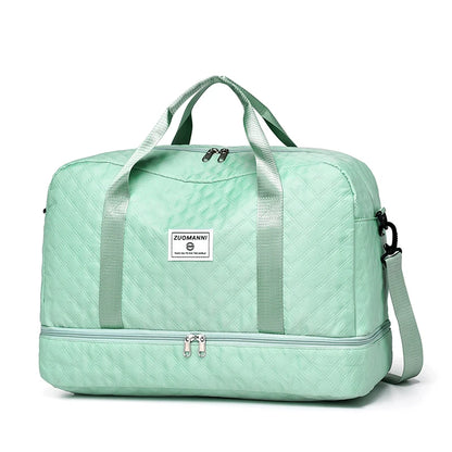 Mint green travel bag with a visible brand label on a white background