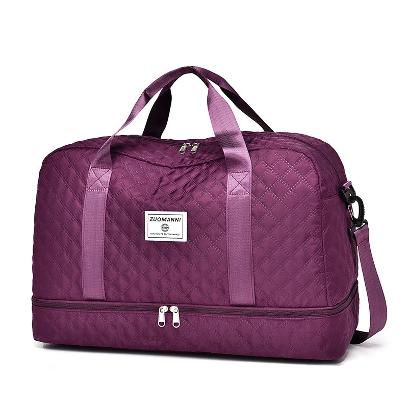 Purple duffel bag with handle and shoulder strap on a white background