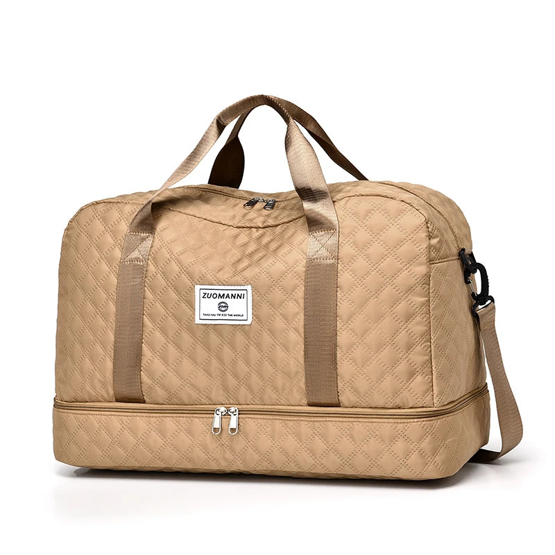 Beige duffel bag with quilted pattern on a white background