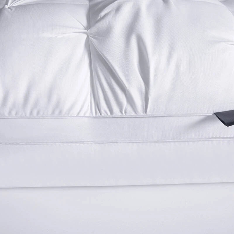 Close-up of a white satin fabric with folds