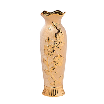 Decorative vase with gold floral patterns on a white background