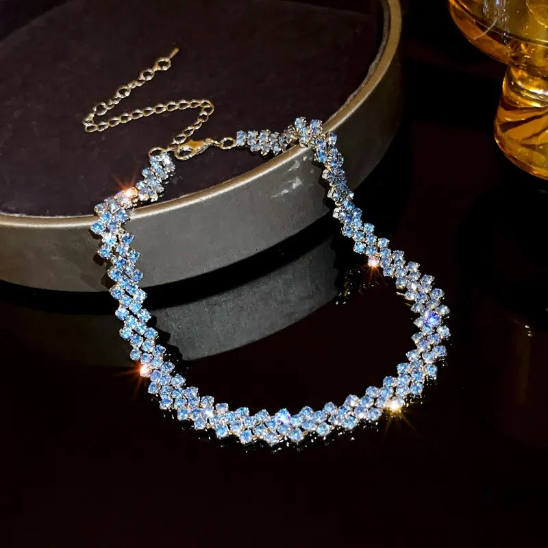 Necklace with blue stones on a dark surface