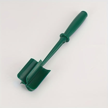 Green gardening tool on a white background