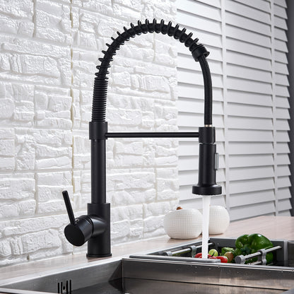 Black kitchen faucet with a pull-down sprayer in a kitchen setting.