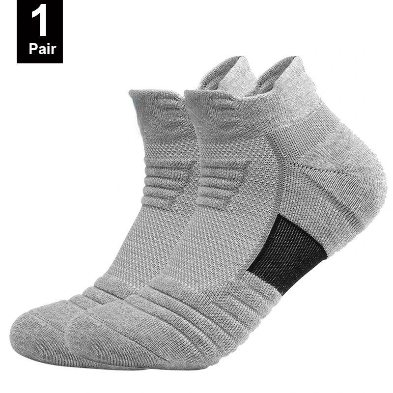 Two gray ankle socks with a brand logo on a white background