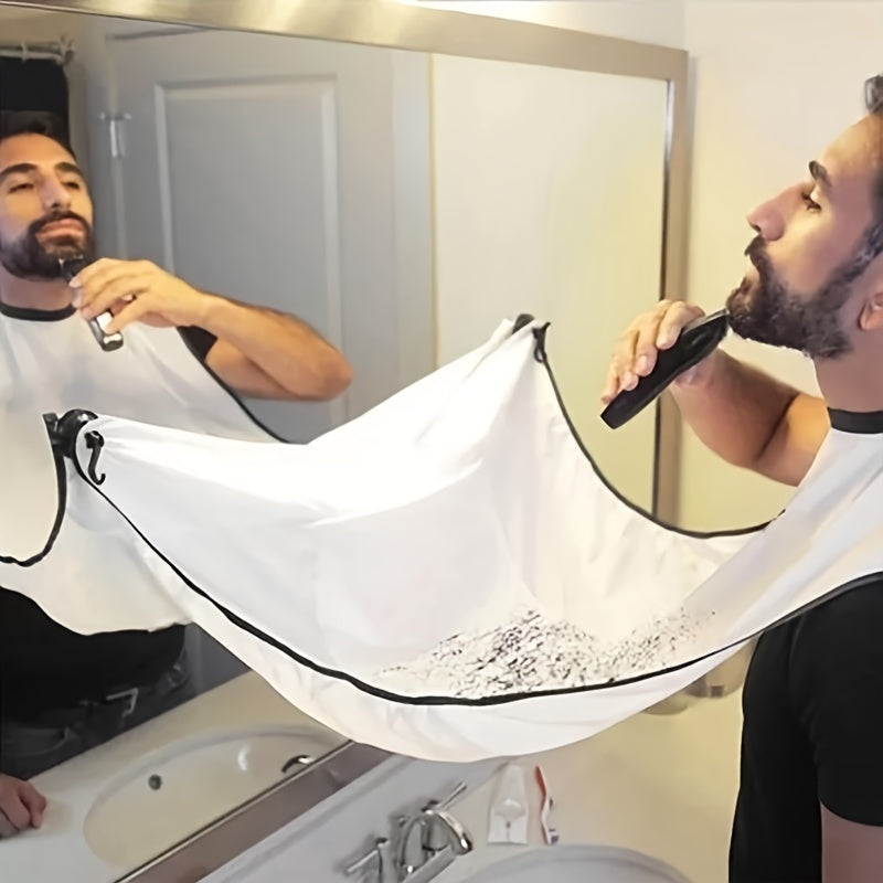 Man using an electric razor with a white protective cover over his shoulder in front of a mirror.