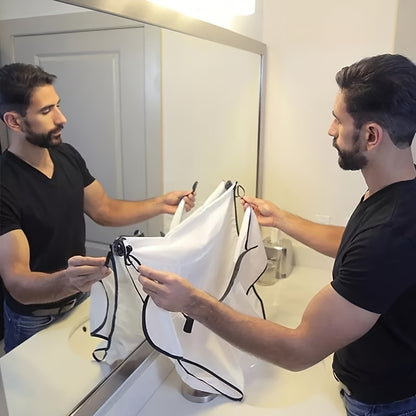 Man using a hairdressing mirror with a white cover in a bathroom.