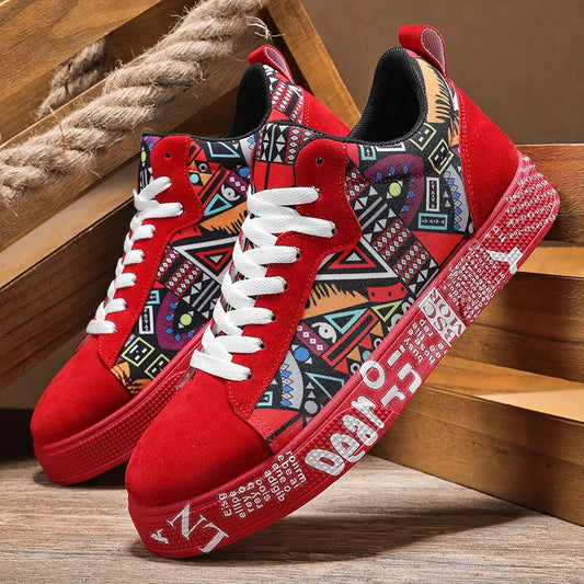 Red sneakers with a colorful geometric pattern on a wooden floor