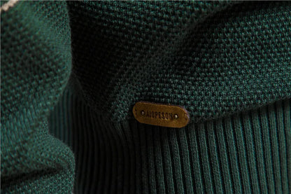 Close-up of a green textured fabric with a brand label on a blurred background