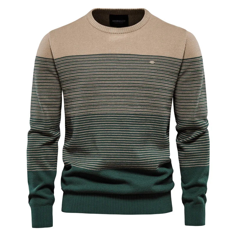Two-tone sweater with beige and green pattern on a white background