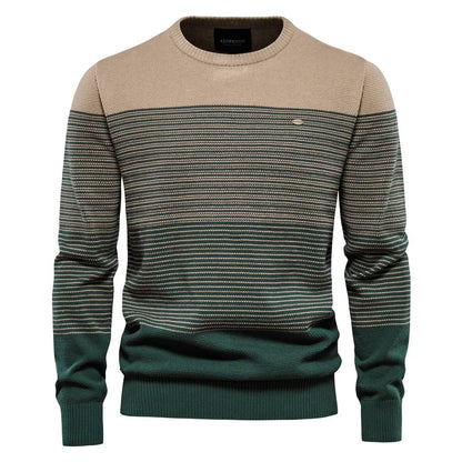 Two-tone sweater with beige and green pattern on a white background