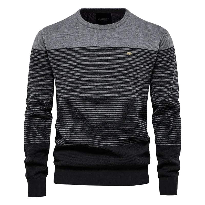 Gray and black striped sweater with a brand logo on a white background