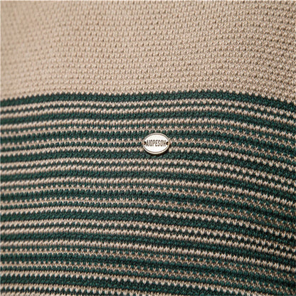 Close-up of a striped fabric with a brand logo in the center.