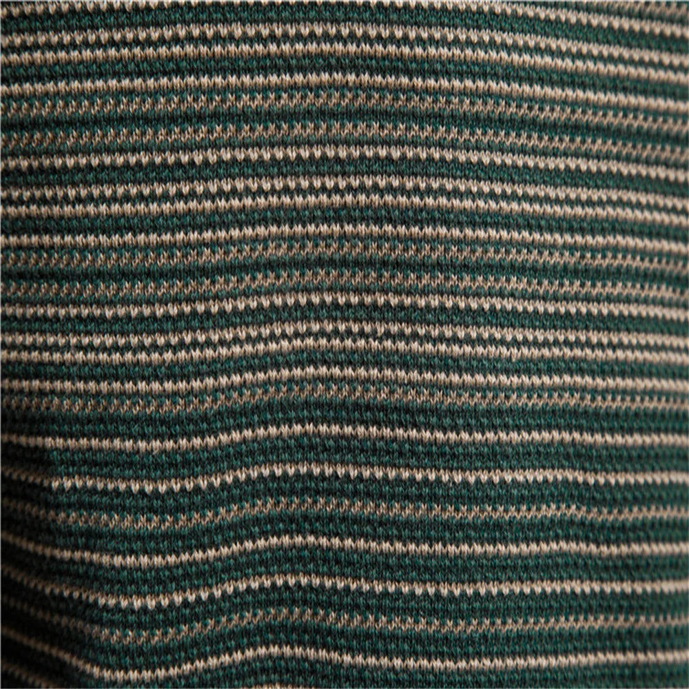 Close-up of green and beige striped fabric texture