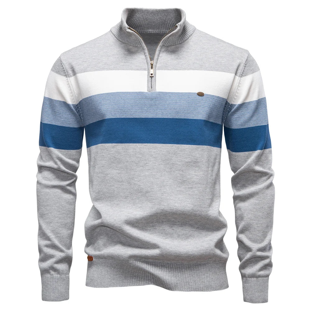 Gray and blue striped sweater with a quarter zip on a white background