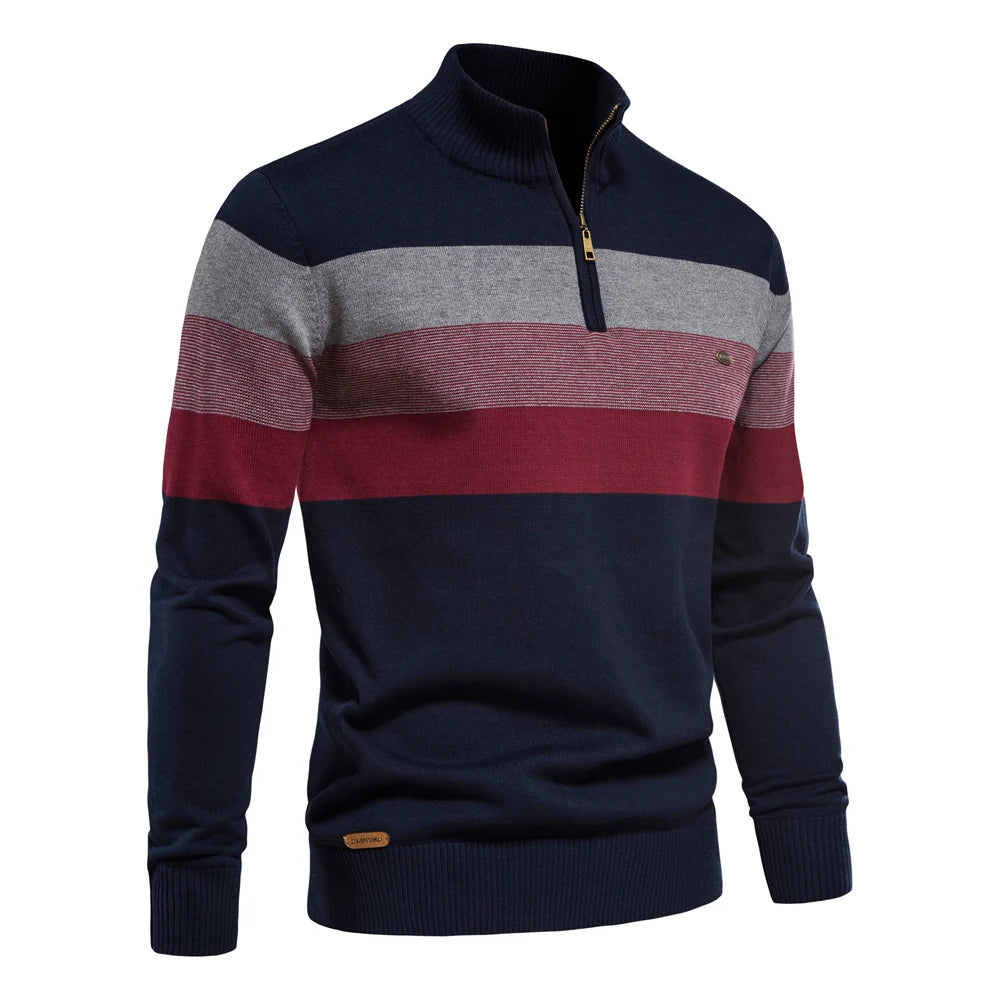 Navy, gray, and red striped sweater on a white background
