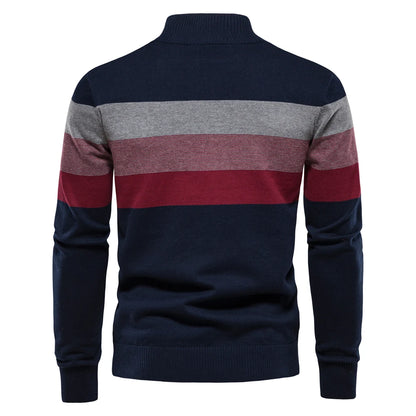 Navy, gray, and red striped sweater on a white background