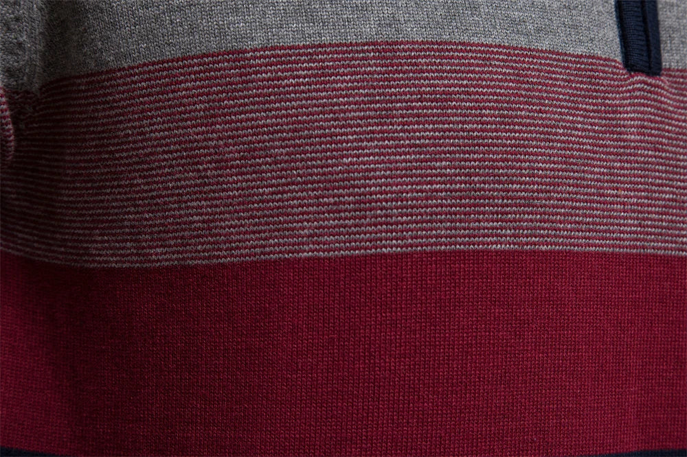 Close-up of a fabric with horizontal gray and red stripes.