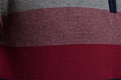 Close-up of a fabric with horizontal gray and red stripes.