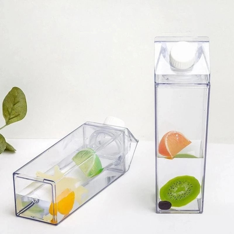 Clear fruit infuser with sliced fruits inside on a white background