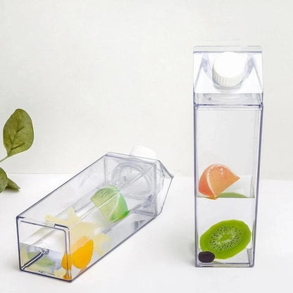 Clear fruit infuser with sliced fruits inside on a white background