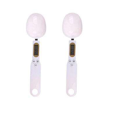 Two digital egg scales with white eggs on a white background