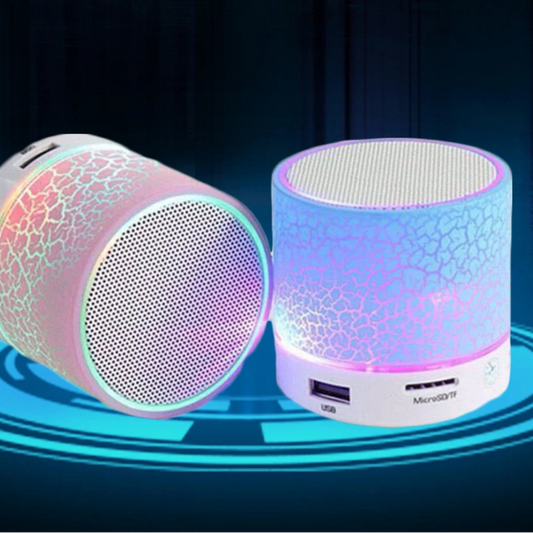 Two colorful Bluetooth speakers with text highlighting features on a dark background