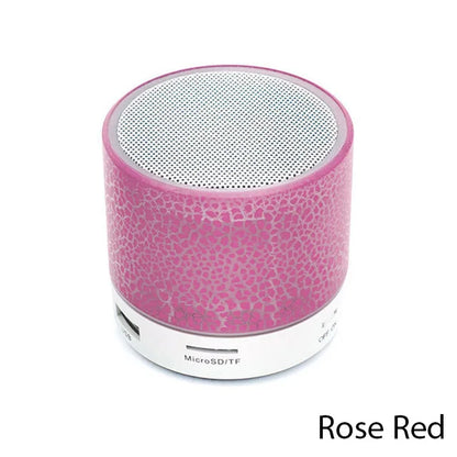 Rose red portable speaker on a white background